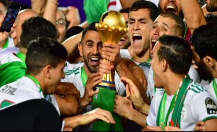 In a photo taken on July 19, 2019, the Algerian team celebrates after winning the 2019 Africa Cup of Nations (CAN) Final football match at the Cairo International Stadium. PHOTO | AFP