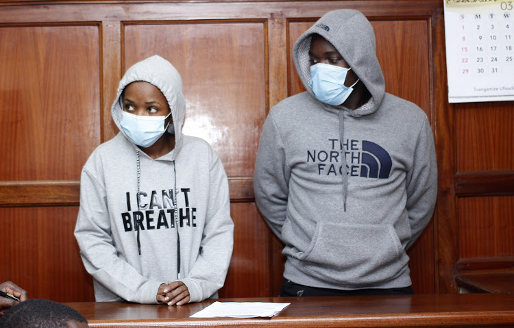JKUAT student Anne Wambui and Antony Ngigge at the Milimani law Court where they were charged with conspiracy to defraud NCBA Bank Kshs.190,767,195.They were released on  Khs.500000 cashbail on October 26,2020.PHOTO/COURTESY.