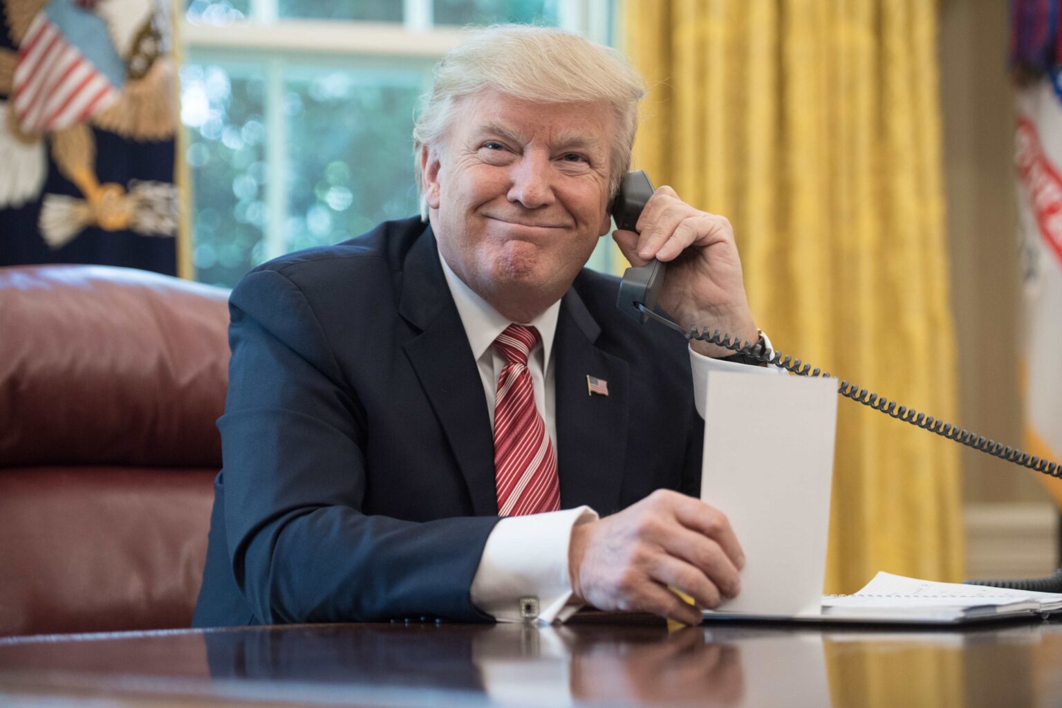 US President Donald Trump waits to speak on the phone with Irish Prime Minister Leo Varadkar to congratulate him on his recent election victory in the Oval Office at the White House in Washington, DC, on June 27, 2017 - Photo Credit [NICHOLAS KAMM/AFP via Getty Images]