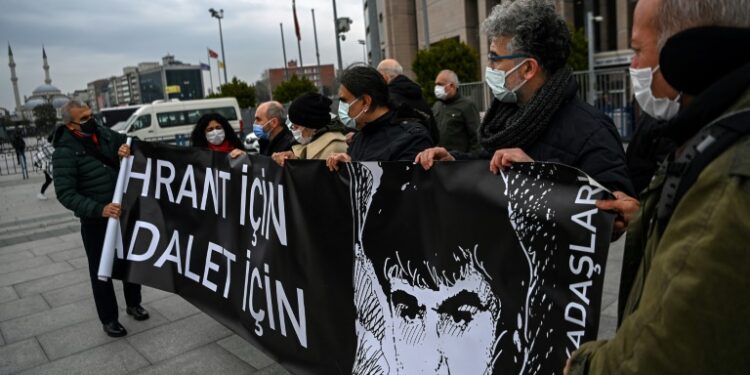 AFP - Demonstrators held banners reading "For Hrant, For Justice" in front of the Istanbul court