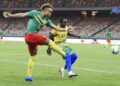 AFP - 
Olivier Miyonzima (R) of Rwanda cannot prevent Pierre Kunde (L) of Cameroon shooting during an Africa Cup of Nations qualifier in Douala on Tuesday.