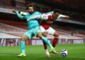 AFP | Liverpool forward Mohamed Salah (L) tussles with Arsenal defender Gabriel at the Emirates.