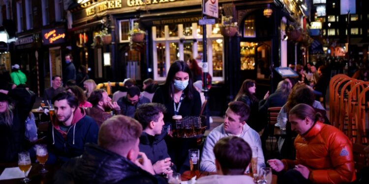 AFP | Customers enjoy a taste of freedom the Soho area of London