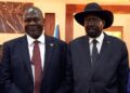 South Sudanese President Salva Kiir (R) stands with First Vice President Riek Machar as they attend a swearing-in ceremony at the State House in Juba, on February 22, 2020, South Sudan: UN experts now warn their power-sharing deal risks collapse | AFP