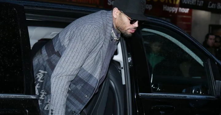 Chris Brown exiting a Car | Photo Courtesy