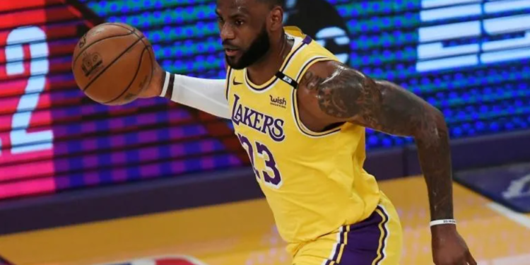 LeBron James breached Covid-19 protocols but will not face suspension, US media reports said Saturday | AFP