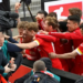 Union Berlin striker Max Kruse (C) is mobbed by team-mates after his winning goal | AFP