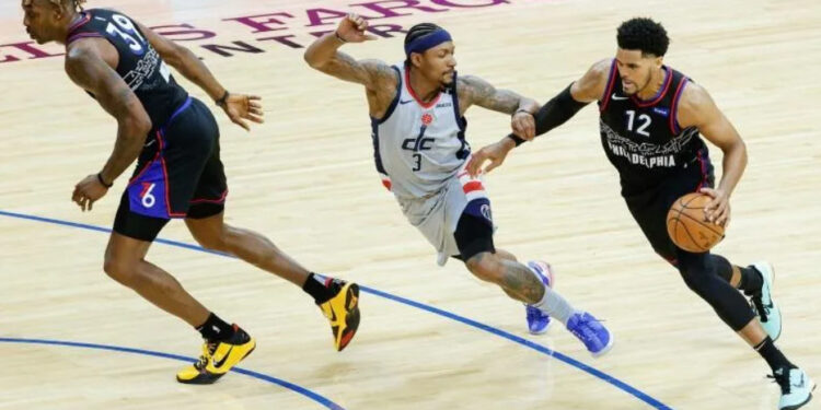 Philadelphia's Tobias Harris drives past Washington's Bradley Beal in their Eastern Conference playoff series opener | AFP