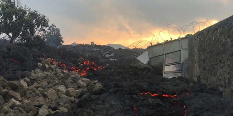 Fire and strong fumes emanated from the blackish molten rock | AFP