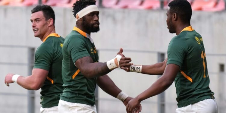 South Africa captain Siya Kolisi (C) congratulates try scorer Aphelele Fassi (R) during a Rugby Championship match against Argentina last weekend | AFP
