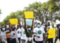 Activists hold placards during a climate change protest in Kenya |  James Wakibia/SOPA Images/LightRocket via Getty Images