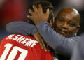 Al Ahly coach Pitso Mosimane (R) celebrates with star forward Mohamed Sherif (L) after the Egyptian club won the CAF Super Cup last May | AFP