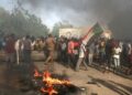 Washington said it was pausing US aid to Sudan after a military takeover in the African nation, where civilians have taken to the streets in protest of the ouster of civilian leaders | AFP