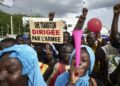 Malians rally in support of the junta several weeks after the 2020 coup. The sign reads: 'A transition led by the army' | AFP
