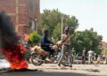 Sudanese demonstrators barricade a street in Khartoum Tuesday amid ongoing protests against a military coup | AFP