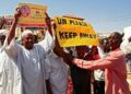 Sudanese pro-military protesters chant slogans as they demonstrate against a UN bid to resolve a political crisis | AFP