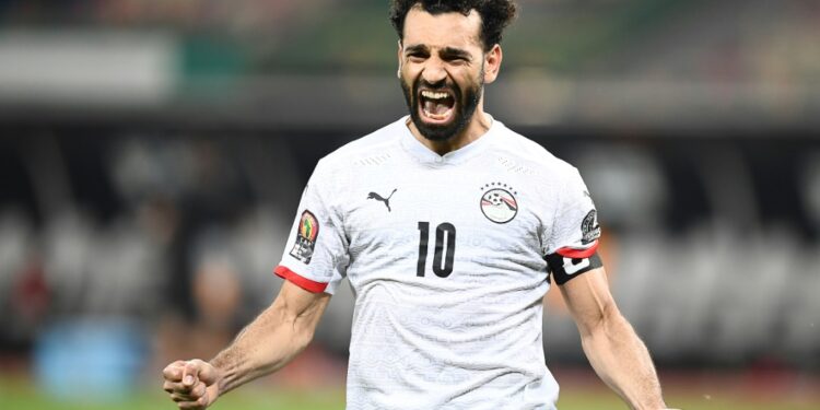 Mohamed Salah celebrates after scoring the winning penalty for Egypt against the Ivory Coast | AFP
