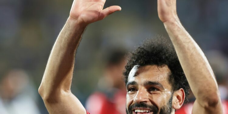 Captain Mohamed Salah acknowledges Egypt supporters after a dramatic quarter-final victory over Morocco in Yaounde | AFP