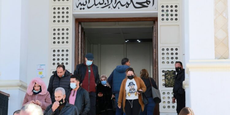 Tunisian citizens and lawyers leave a court in the governorate of Ariana after the announcement of the judges' strike |
AFP