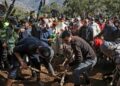 Moroccans bury five-year-old Rayan Oram in the village of Ighrane in Morocco's rural northern province of Chefchaouen | AFP