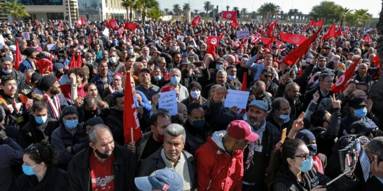 Tunisians protest against a power grab by President Kais Saied who on Sunday extended his control of the judiciary | AFP