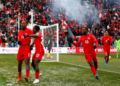 Cyle Larin celebrates a goal as Canada beat Jamaica to qualify for the World Cup for the first time in 36 years | AFP/Vaughn Ridley