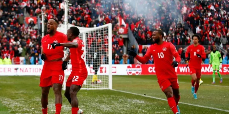 Cyle Larin celebrates a goal as Canada beat Jamaica to qualify for the World Cup for the first time in 36 years | AFP/Vaughn Ridley