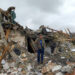 A Ukrainian man stands in the rubble in Zhytomyr following Russian bombing | Emmanuel DUPARCQ