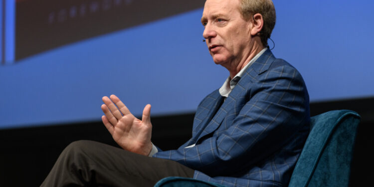 Microsoft President Brad Smith speaking at Seattle’s Town Hall in 2019 | GeekWire Photo |  Kevin Lisota