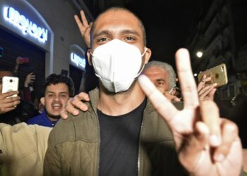 Algerian journalist Khaled Drareni is greeted by supporters in the capital Algiers, following his release from prison under a presidential pardon, on February 19, 2021 | AFP