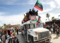 A parade to commemorate the 2011 uprising that toppled Libyan strongman Moamer Kadhafi, in the coastal city of Tajura, east of the capital Tripoli, on February 25, 2022 | AFP