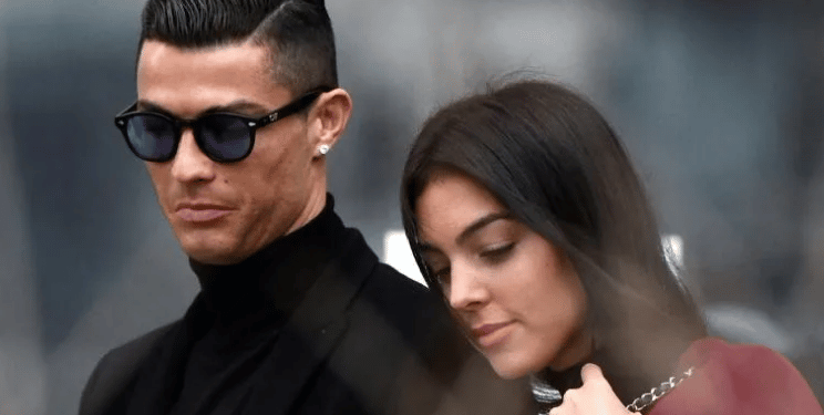 Cristiano Ronaldo (left) and his partner Georgina Rodriguez (right) announced the death of their baby son on Monday | AFP/OSCAR DEL POZO