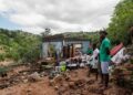 The remains of a house at KwaNdengezi township near Durban -- 10 people in the township are listed as missing | AFP