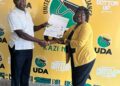 Naivasha MP Jayne Kihara receiving her UDA nomination certificate after the party repeated the nomination process by way of interviews