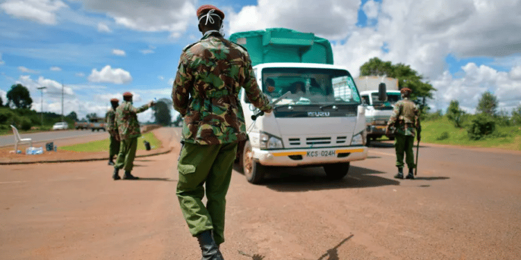 General Service Unit officers, part of Kenya’s police service, stop a commercial vehicle at a checkpoint. Tony Karumba | AFP via Getty Images