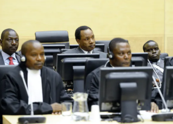 William Ruto (L, back row), Henry Kosgey (C, back row) and radio presenter Joshua Arap Sang (R, back row), at the ICC in 2011, charged in connection with post-election violence. LEX VAN LIESHOUT | AFP via Getty Images
