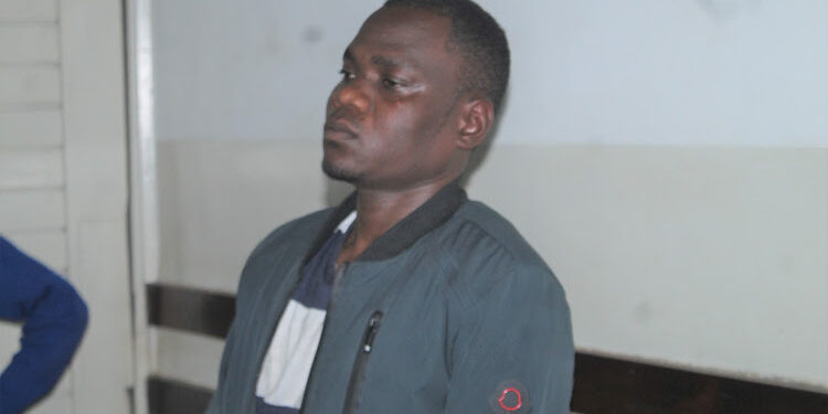 Dan Simiyu at the Kibera court.He is charged with stepping on his wife's abdomen.Photo/Courtesy
