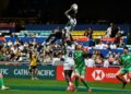 AFP Kenya's Johnstone Olindi (top) is lifted by teammate Herman Humwa (C) against Ireland in the Hong Kong Sevens rugby tournament on November 4, 2022. Kenya's Rugby Sevens