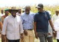 Nairobi Governor Johnson Sakaja (in stripped shirt)  with President William Ruto during a tour of the Galana Kulalu project.Photo/Courtesy